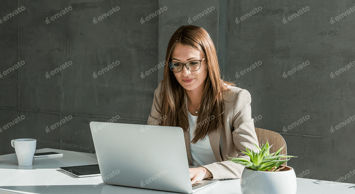 Business owner managing payments on a laptop